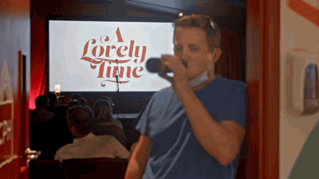 a man is taking a picture of a screen that says a lovely time