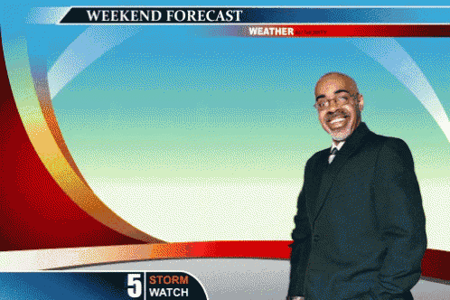 a man in a suit and tie stands in front of a weather forecast screen