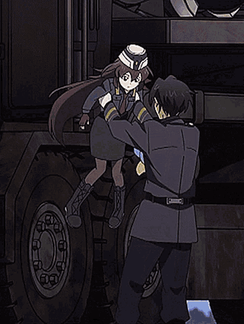 a man and a girl are standing next to each other in front of a military vehicle