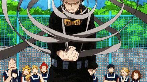 a man in a black shirt is standing in front of a group of people holding a sword .