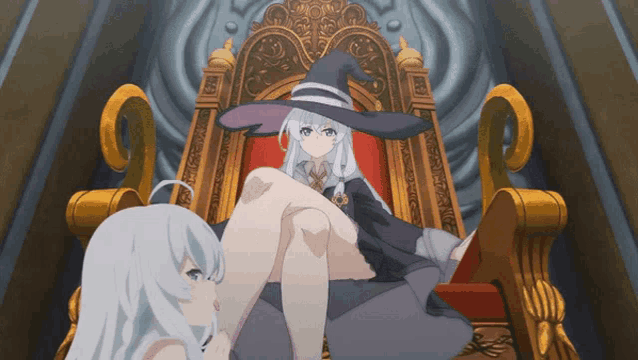 a witch is sitting on a throne with another witch
