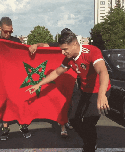 a man in a red shirt with the number 2 on it