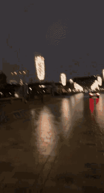 a blurry picture of a car driving down a street