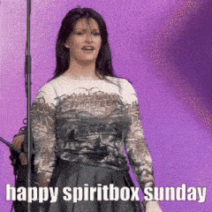 a woman is standing in front of a microphone with the words happy spiritbox sunday written on the bottom