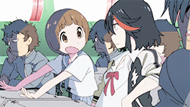 a group of anime characters are sitting around a table and one of them has a star on her back