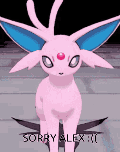 a pink bunny with blue ears and a red spot on its forehead says sorry alex :)