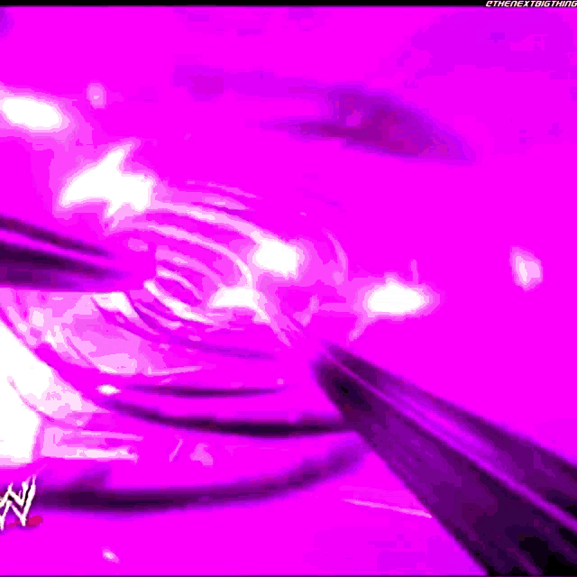 a purple background with a wrestling logo in the corner