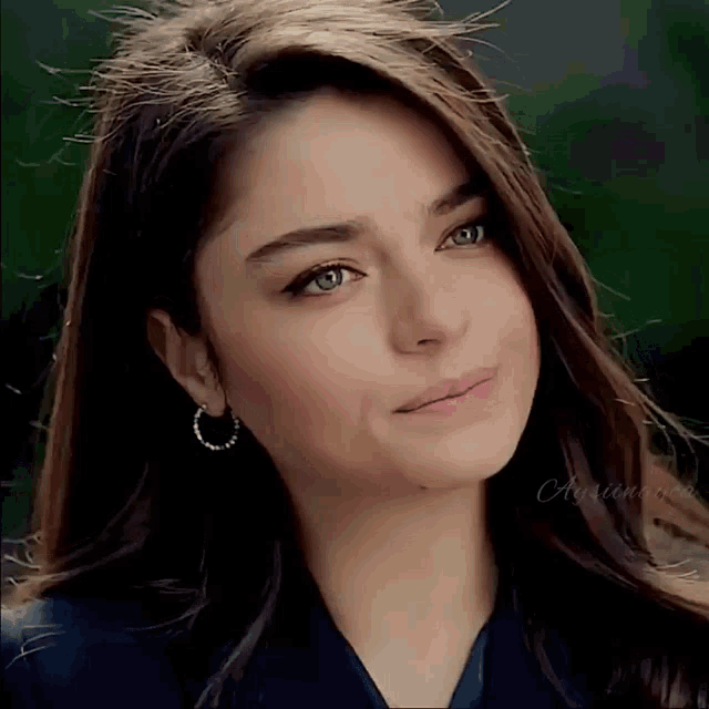 a close up of a woman 's face with the name autumn on the bottom