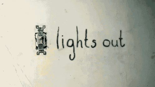 the word lights out is written on a wall
