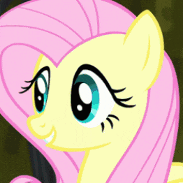 a close up of a pink and yellow pony with big blue eyes