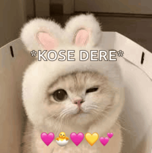 a cat wearing a bunny hat with hearts around it .