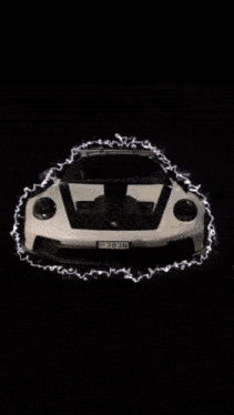 a car is driving down a road and the word wasoei is visible in red
