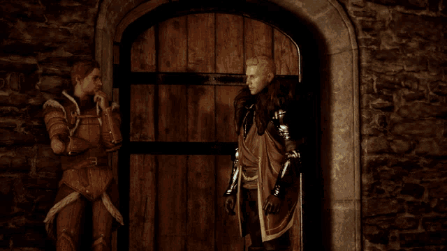 a man in armor stands next to a woman in armor