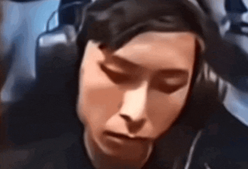 a close up of a person wearing headphones .