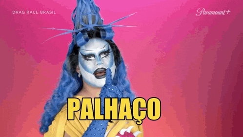a drag queen from drag race brasil is wearing a blue and white wig