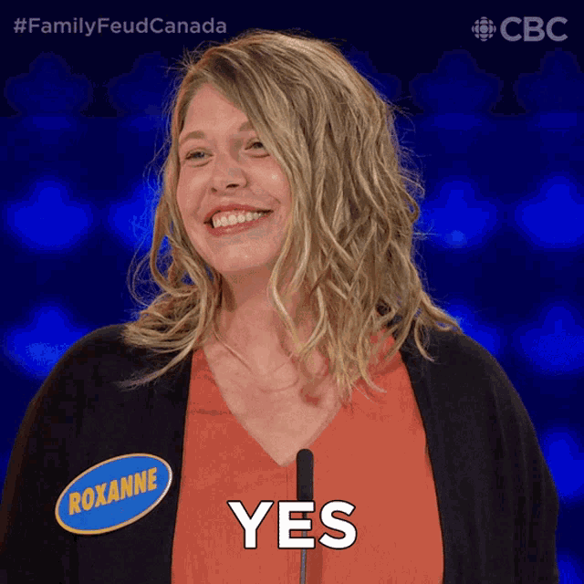 a woman with a name tag that says roxanne is smiling and saying yes