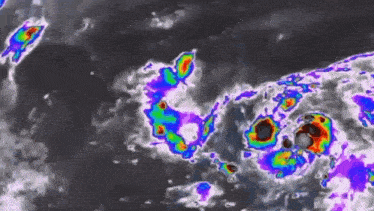 a satellite image of a tropical cyclone moving through the ocean