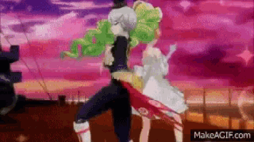 a man and a woman are dancing together in front of a pink sky .