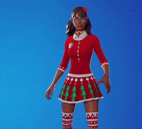 a woman in a red dress with christmas trees on it is waving her hand .