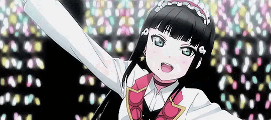 a girl in a maid costume is dancing on a stage with her arms outstretched .