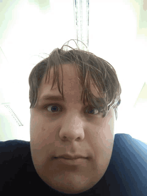 a close up of a person 's face with a very thick neck