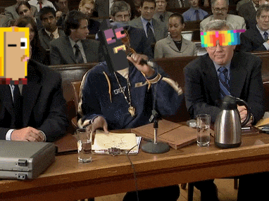a man in a suit is sitting at a table with a briefcase and glasses on it