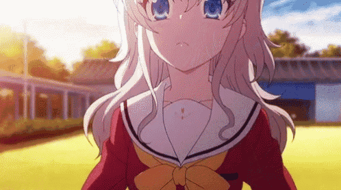 a girl with blonde hair and blue eyes is wearing a school uniform and a bow tie .