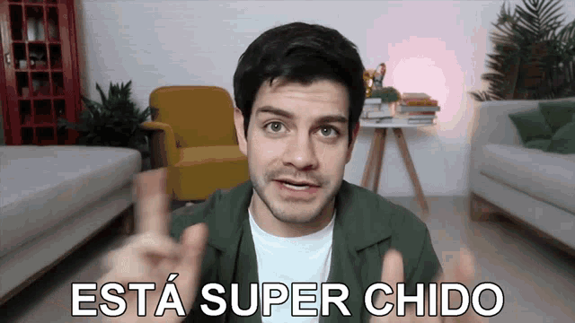 a man giving a thumbs up with the words esta super chido written below him