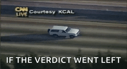 a white suv is driving down a highway with a cnn courtesy kcal sign behind it .