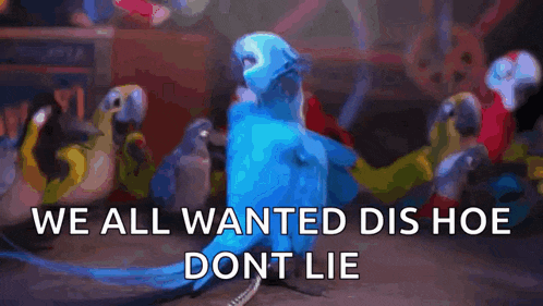 a blue parrot from the movie rio is standing in front of a group of parrots .