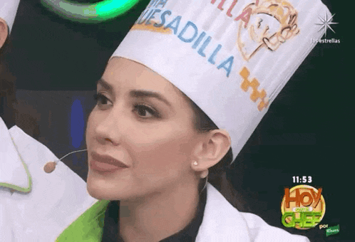 a woman wearing a chef hat that says mesadilla