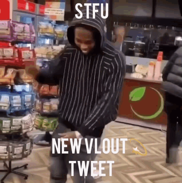 a man in a striped hoodie is dancing in a store with the caption stfu new vlout tweet