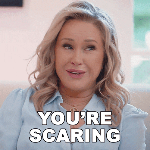 a woman says " you 're scaring " while sitting on a couch