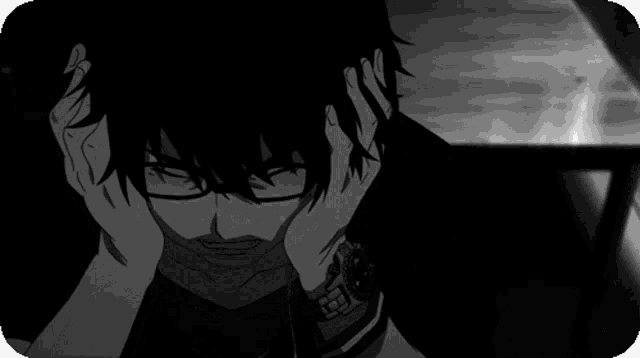 a black and white image of a person 's face and hands
