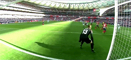 a soccer player with the number 13 on his back