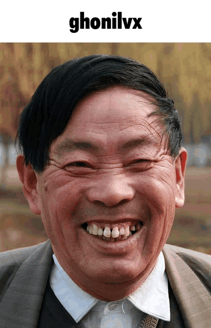 a man with a big smile and the word ghonilvx on top of him