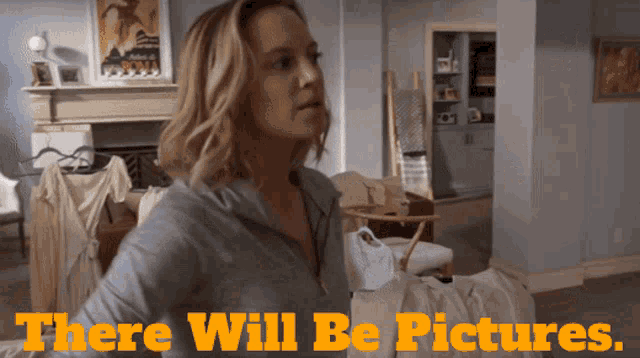 a woman in a living room with the words " there will be pictures " on the bottom