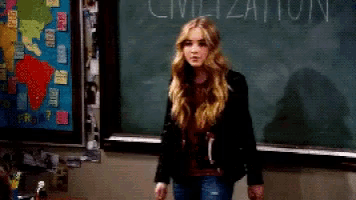a girl stands in front of a chalkboard that says civilization