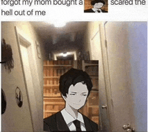 a man in a suit and tie is standing in a hallway