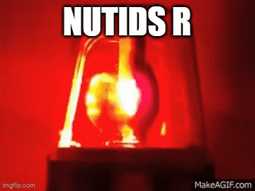a red light with the words nutids r written above it
