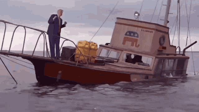 a man stands on the deck of a boat that says a.s. campbell on it