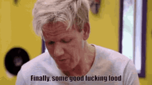 a man in a white shirt is eating food and saying `` finally some good fucking food '' .
