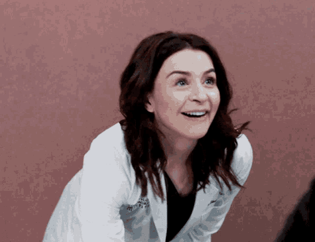 a woman wearing a white lab coat with a name tag that says ' dr. ' on it