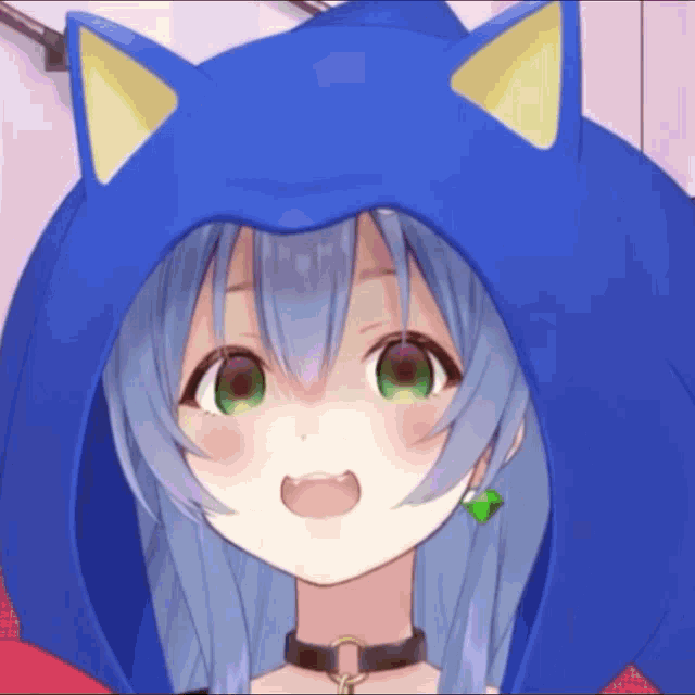 a close up of a girl wearing a blue hoodie with ears