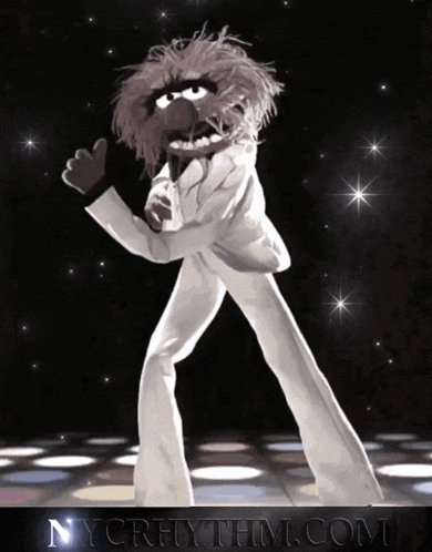 a picture of a muppet dancing with the website nycrhythm.com in the background