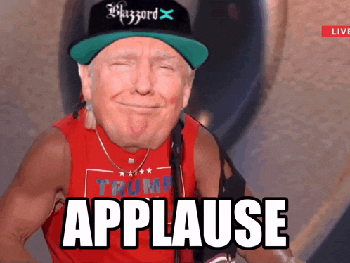 a man wearing a trump shirt and a hat with the word applause on it