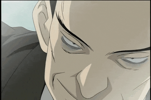 a close up of a man 's face with a very angry look on his face