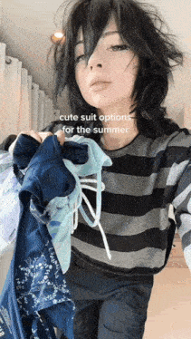 a girl is holding a bunch of clothes and a caption says cute suit options for the summer