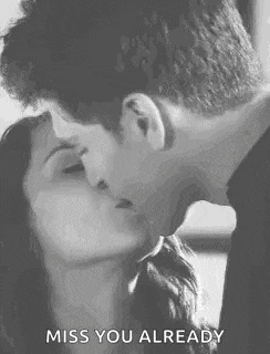 a man and a woman are kissing in a black and white photo with the words `` miss you already '' .