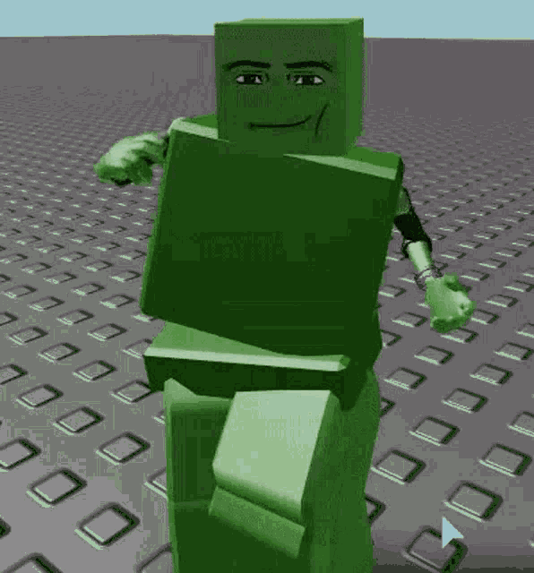 a green block with a face and arms is standing on a grid of squares .
